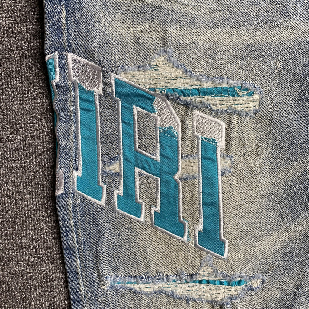 AMIRI VARSITY LOGO JEANS - netstar®