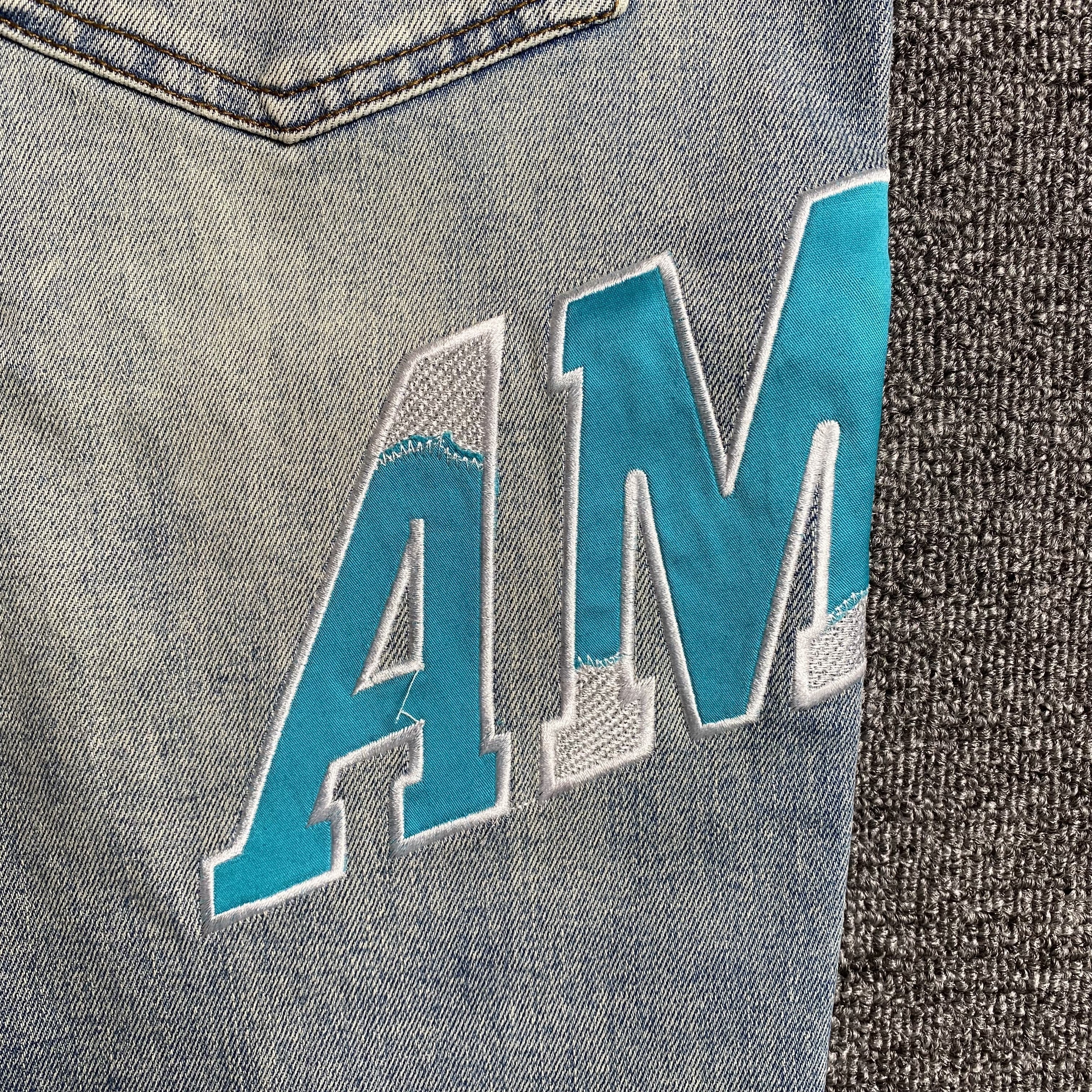 AMIRI VARSITY LOGO JEANS - netstar®