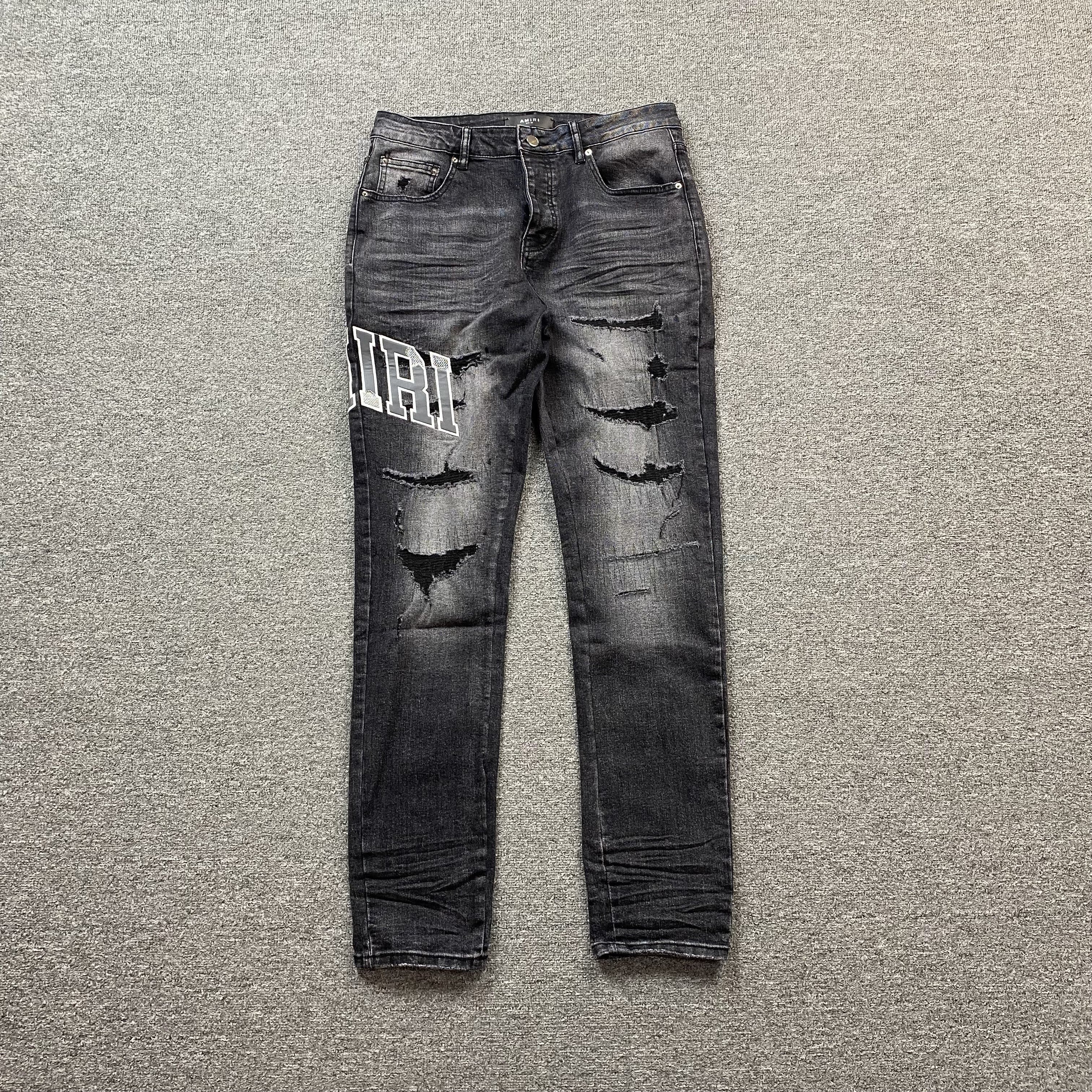 AMIRI VARSITY LOGO REPAIR JEANS - netstar®