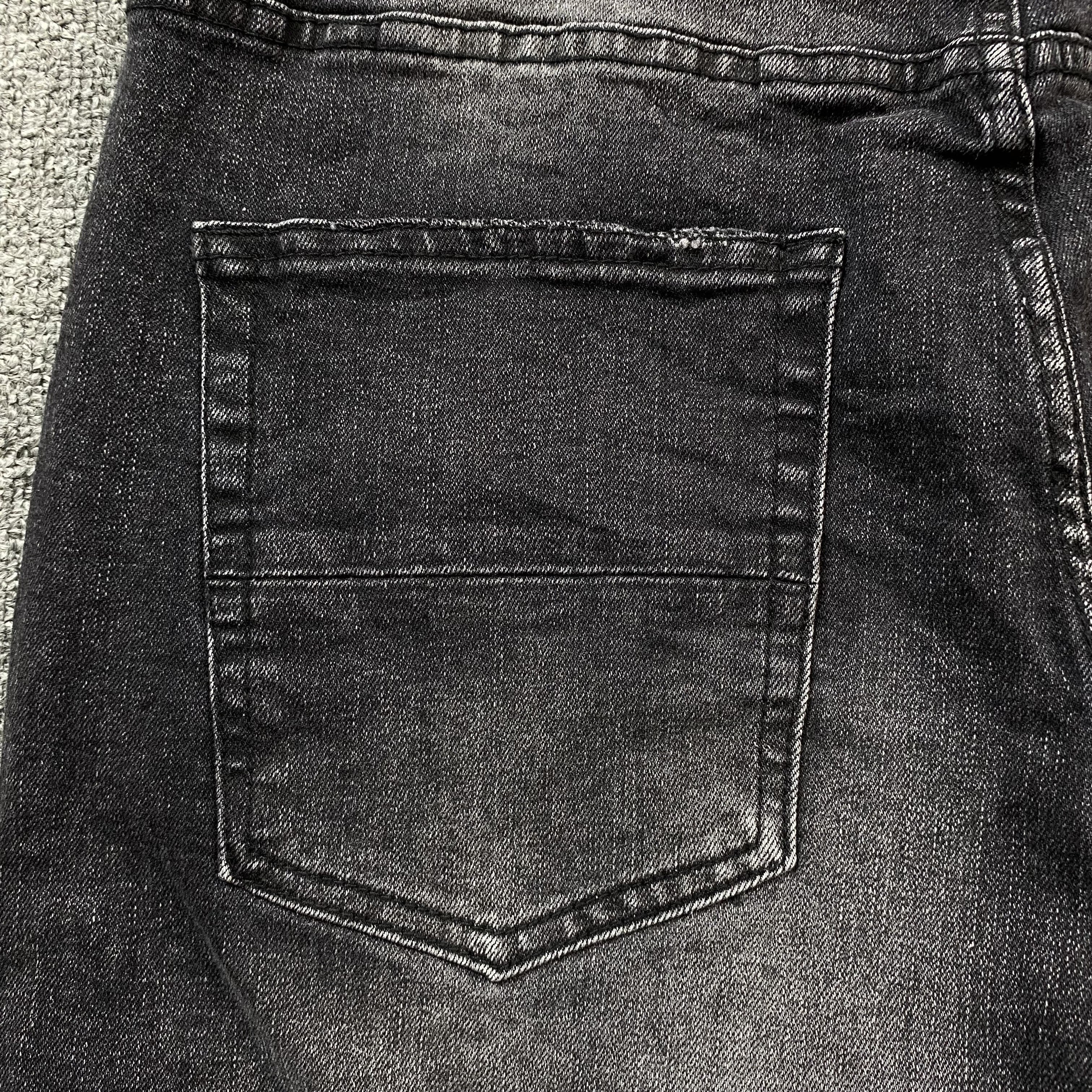 AMIRI VARSITY LOGO REPAIR JEANS - netstar®
