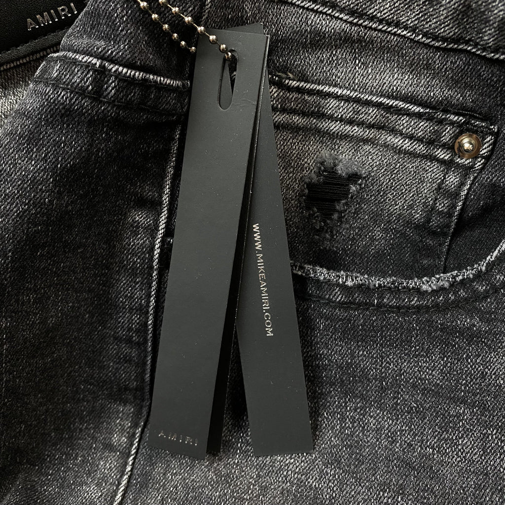 AMIRI VARSITY LOGO REPAIR JEANS - netstar®
