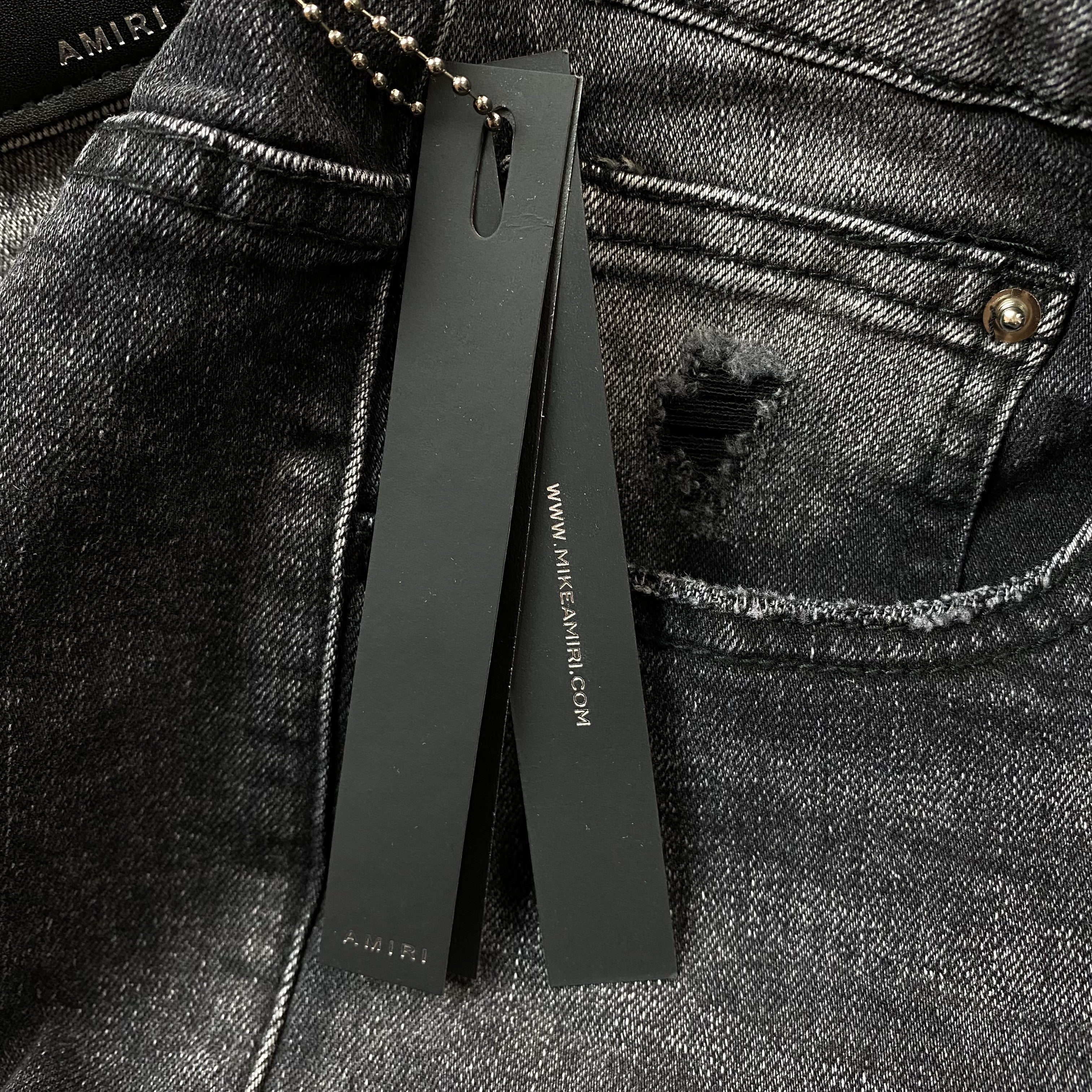 AMIRI VARSITY LOGO REPAIR JEANS - netstar®