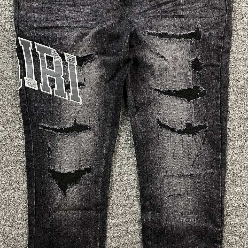 AMIRI VARSITY LOGO REPAIR JEANS - netstar®