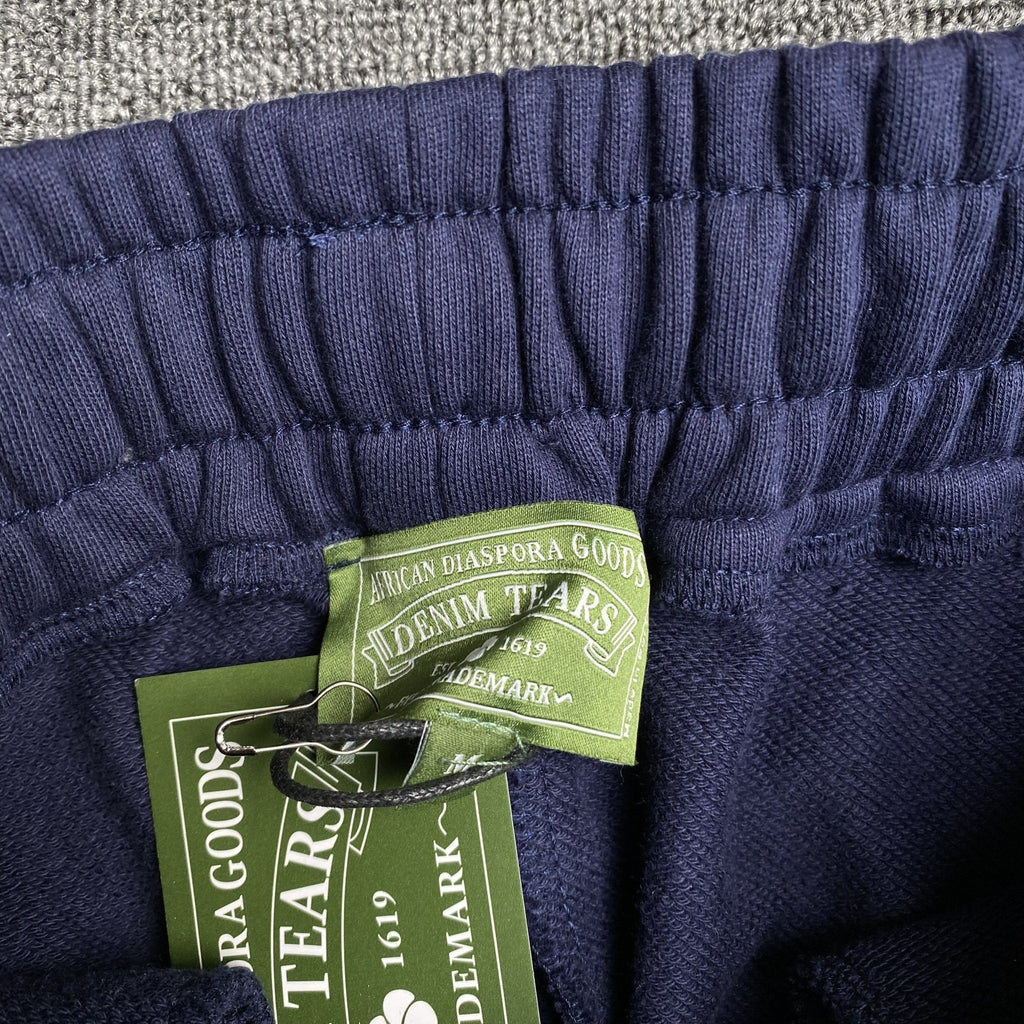 DENIM TEARS COTTON WREATH SWEATPANTS NAVY - netstar