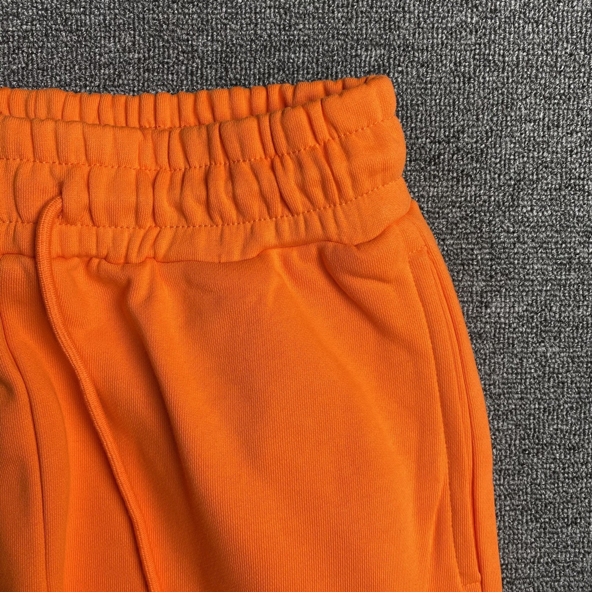 DENIM TEARS COTTON WREATH SWEATPANTS ORANGE - netstar